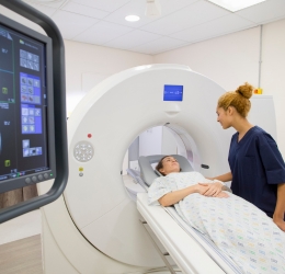 Checking doctor while patient is on the MRI Machine